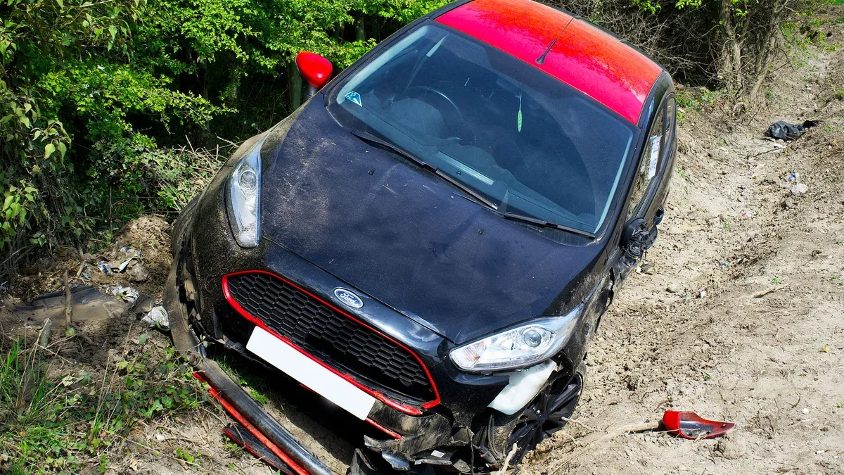 Damaged car after an accident on a dirt road in Welwyn Garden City, UK.