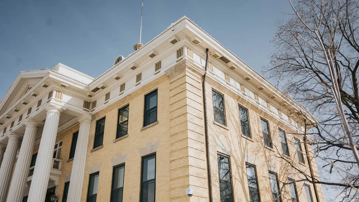 Low angle view of the historic Box Elder County Courthouse with columns and blue sky, Brigham City, Utah.