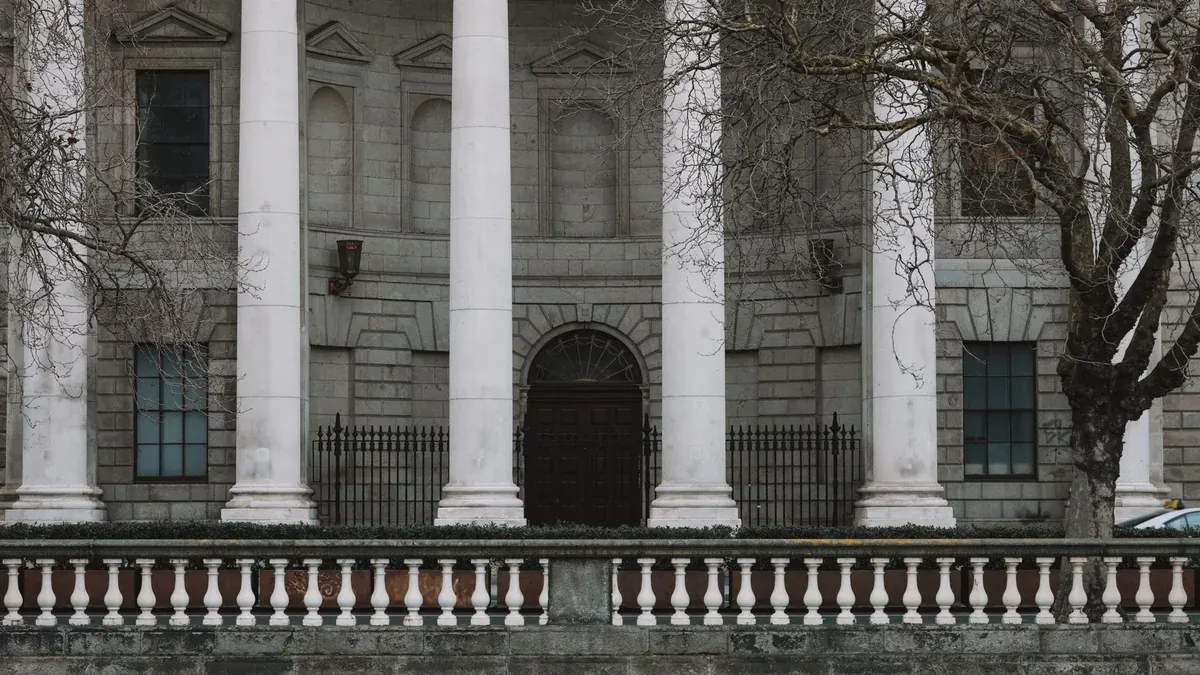 Elegant neoclassical facade of Dublin's Four Courts with iconic white columns.