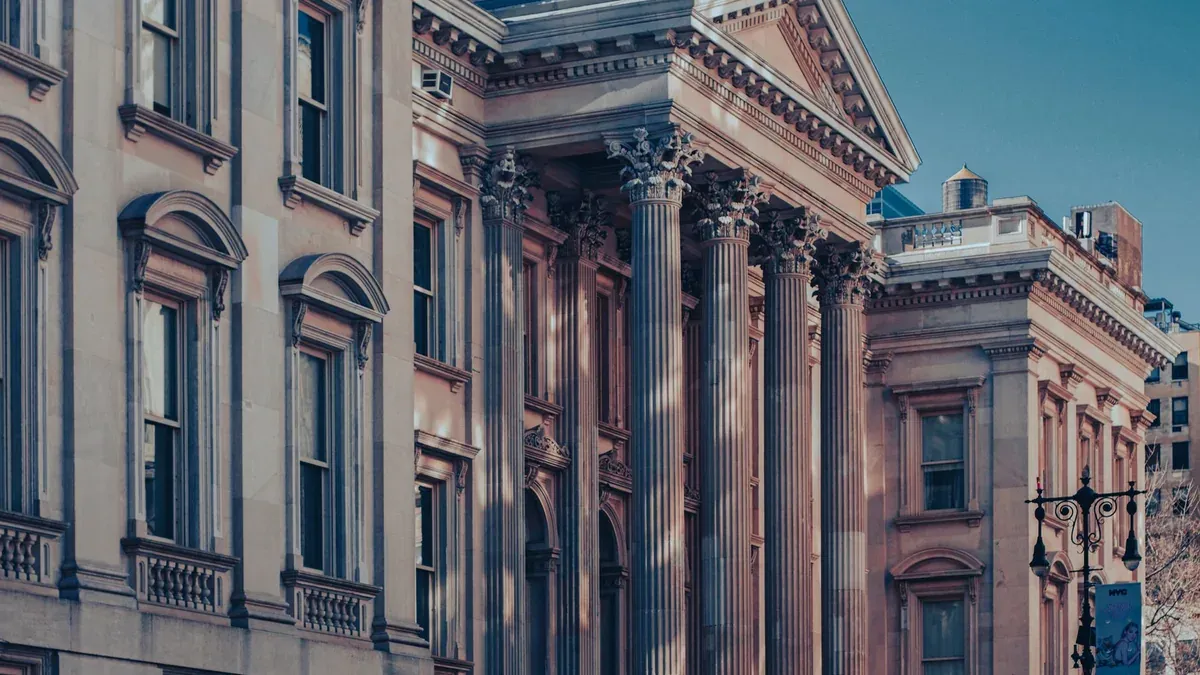 Neoclassical architecture of Tweed Courthouse in Manhattan at dusk capturing urban elegance.