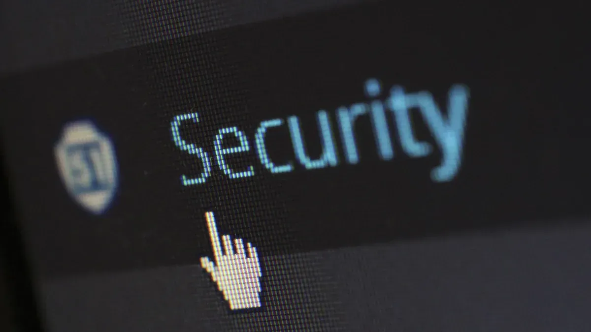 Close-up view of a mouse cursor over digital security text on display.
