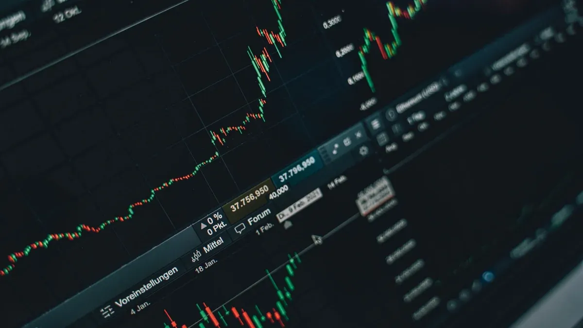 Close-up of stock market trading screen displaying financial growth and charts.