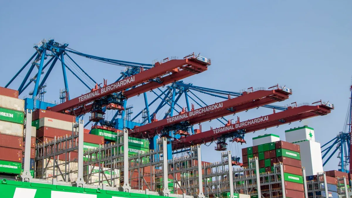 View of cargo containers and cranes at Terminal Burchardkai in Hamburg port.