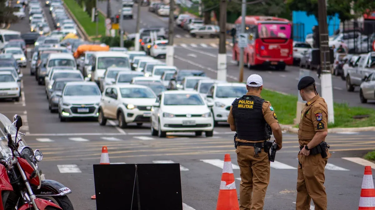 Police officers manage traffic congestion in a busy urban city street.