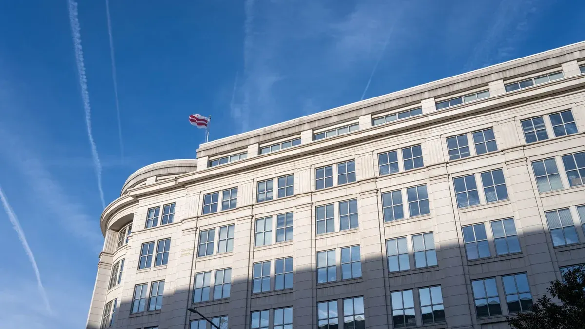 Elegant office building under a clear blue sky in Washington, D.C.