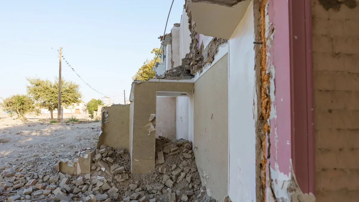 Demolition site of an abandoned building in Samarkand, highlighting urban decay and construction debris.