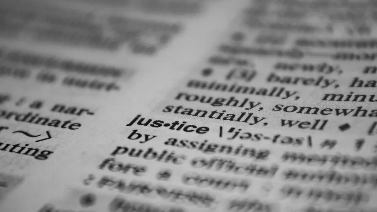 Selective focus close-up of the word justice in a dictionary, emphasizing concept clarity.