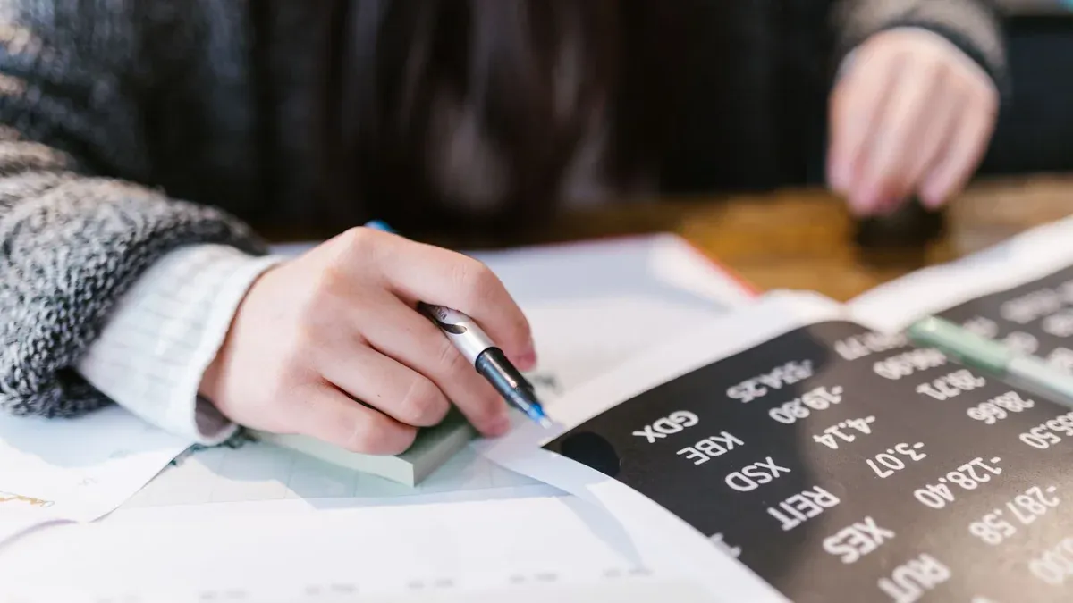 Close-up of a woman reviewing financial documents with focus on numbers and calculations.